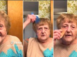 En el video se ve a la mujer peinándose y pintando sus labios en medio de la emoción. ESPECIAL/CAPTURA DE VIDEO