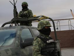 Elementos de seguridad resguardan una casa en la colonia El Mante. ARCHIVO
