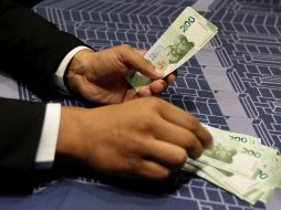 Los mercados accionarios trabajan con pocos cambios, con el dólar apreciándose a lo largo de la jornada. NTX/ARCHIVO