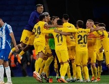 En su primera temporada completa en el banquillo, Xavi conquistó su primer título en España. AP/Joan Monfort