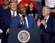 Donald Trump, Lindsey Graham y Tim Scott. AP