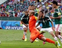 México estuvo muy cerca de lograr su pase a cuartos de final en el Mundial de Brasil. AP/Archivo