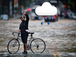El pronóstico para este martes espera, durante la tarde, cielo nublado con lluvias puntuales muy fuertes en Colima y Michoacán, así como lluvias fuertes en Jalisco. AFP / ARCHIVO