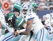 Micah Parsons (#11) capturó en dos ocasiones a Zach Wilson. AFP