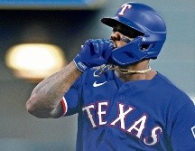 Adolis García le puso la cereza al pastel del duelo de ayer en Houston con un grand slam en la novena. AFP