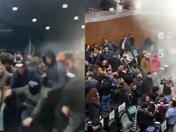 Un grupo de personas encapuchadas vestidas con los colores rojo y verde irrumpió con violencia en el salón de sesiones, impidiendo así que se llevaran a cabo las labores legislativas. ESPECIAL