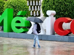 Las lluvias de fuertes a torrenciales, podrían originar visibilidad reducida, deslaves, encharcamientos o inundaciones, así como incremento en los niveles de ríos y arroyos. SUN / ARCHIVO