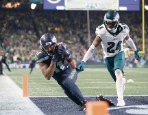 Jackson Smith-Njigba (izq.) hizo la atrapada de la victoria. AFP/S. Chambers