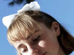 Las mujeres que se han identificado con este estilo, suelen llevar ropa de encaje, moños, zapatos de tacón y charol, vestidos y faldas, uñas aperladas, entre otro tipo de accesorios. ESPECIAL / Foto de Morgan Lane en Unsplash