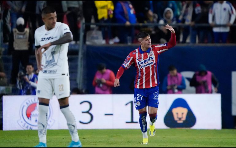 Benjamín Galdames celebra el tercer gol del San Luis detrás de Robert Ergas, que muestra su frustración. IMAGO7/S. Laureano