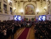 Los presentes en el Congreso ovacionaron a la familia y su mención durante los discursos, así como la llegada de Boric. AP / E. FELIX