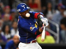 Alcides Escobar inició el camino a la victoria con un elevado de sacrificio. AFP/C. Khanna