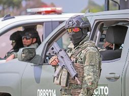 Los militares llegaron a las zonas comerciales afectadas; no hubo detenidos. AFP