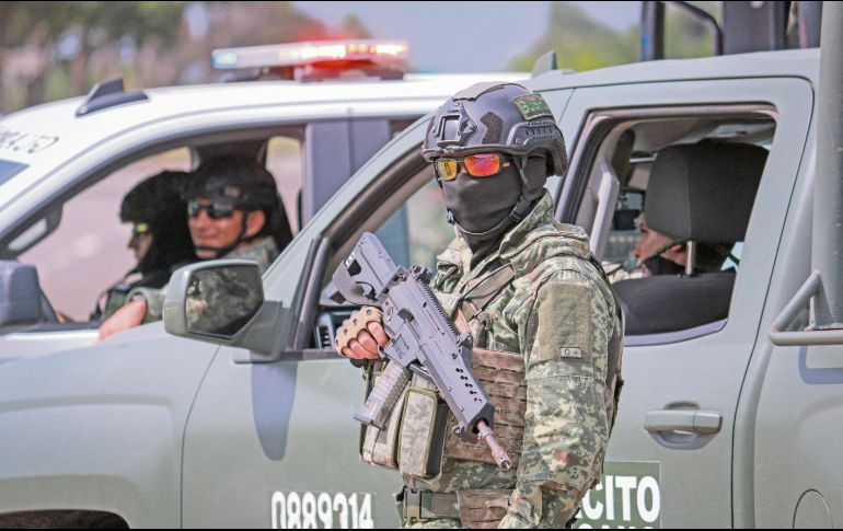 Los militares llegaron a las zonas comerciales afectadas; no hubo detenidos. AFP