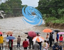 Más de 200 viviendas fueron destruidas y unas 3 mil 200 dañadas en Honduras, mil 794 comunidades quedaron incomunicadas por crecidas de los ríos, caídas de puentes y derrumbes en carreteras. AFP / O. Sierra
