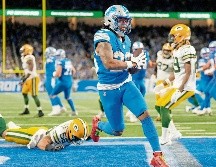 Jahmyr Gibbs esquiva a los defensivos y llega a zona de anotación. AFP/Getty Images/N. Antaya