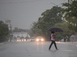 Las lluvias de más intensidad podrían venir con descargas eléctricas; generar encharcamientos, deslaves e inundaciones en zonas bajas. EFE / ARCHIVO