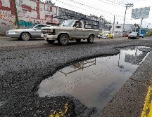 Para reportar baches o socavones en Guadalajara y Zapopan, pueden llamar al número de GuaZap: 33-3610-1010. EL INFORMADOR/ H. Figueroa.