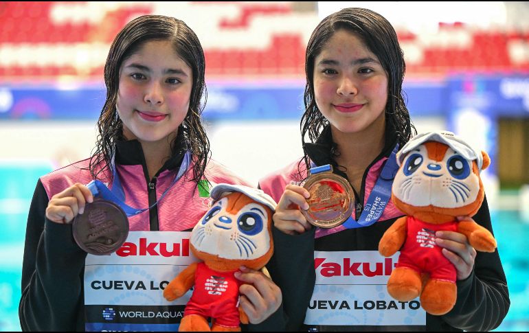 Con esta actuación, Mía y Lía Cueva aportaron la quinta medalla para México en el actual certamen internacional. AFP / F.X. Marit