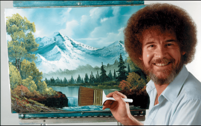 Ross, un pilar de la televisión pública durante las décadas de 1980 y 1990, era conocido por su frondoso cabello y su cálida personalidad Bob Ross posa para una fotografía frente a una de sus obras. Bob Ross Inc./AP