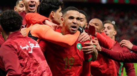 Los jugadores de Marruecos festejando la victoria que los regreso a instancias finales 22 años después. AP/M. Elshamy
