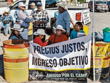 Productores de maíz amenazan con bloquear de nuevo carreteras, en protesta por la caída de precios y el incumplimiento de apoyos. Amagan con afectar eventos del Mundial de Futbol. EL INFORMADOR/ A. Navarro
