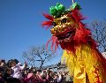 BEIJING (China), 17/02/2026.- Attendees look at performers taking part in a lion dance at the Dongyue Temple on the day of the Chinese Lunar New Year in Beijing, China, 17 February 2026. The Chinese New Year, also known as Lunar New Year, begins on 17 February, ushering in the Year of the Fire Horse with festivities running during the Spring Festival until the Lantern Festival on 03 March. EFE/EPA/ANDRES MARTINEZ CASARES
