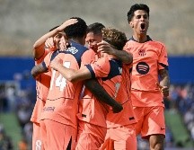 El Barça se afianza en el liderato del campeonato, ahora con una amplia ventaja de once puntos sobre el Real Madrid, a falta de cinco jornadas y quince puntos por disputarse. AFP / J. Soriano