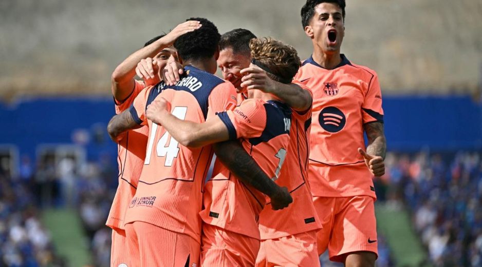 El Barça se afianza en el liderato del campeonato, ahora con una amplia ventaja de once puntos sobre el Real Madrid, a falta de cinco jornadas y quince puntos por disputarse. AFP / J. Soriano