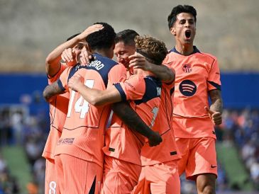 El Barça se afianza en el liderato del campeonato, ahora con una amplia ventaja de once puntos sobre el Real Madrid, a falta de cinco jornadas y quince puntos por disputarse. AFP / J. Soriano