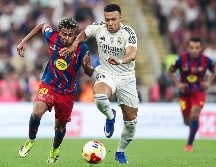 El cuadro blaugrana suma 88 puntos y aventaja por 11 unidades al conjunto merengue. AFP/ ARCHIVO.