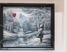 La obra de Banksy fue vendida por 17.9 millones de dólares, en Nueva York. EFE