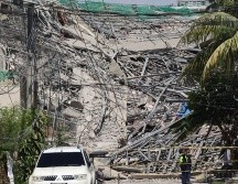 La tragedia ocurrió en una estructura de hormigón de nueve pisos aún sin terminar. AP