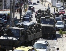 Además de los detenidos, agentes incautaron tres fusiles, una pistola y droga. EFE/ARCHIVO