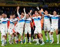Jugadores de Universidad Católica festejan la victoria sobre Boca Juniors que les dio el primer lugar del grupo D de la Copa Libertadores. AP/G. Garello