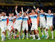 Jugadores de Universidad Católica festejan la victoria sobre Boca Juniors que les dio el primer lugar del grupo D de la Copa Libertadores. AP/G. Garello