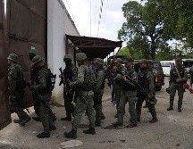 Soldados allanan el Centro Penitenciario de Tocorón, lugar de origen de la banda Tren de Aragua, en Tocorón, Venezuela. AP/ARCHIVO