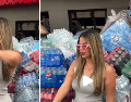 La pose de Paola Faria en medio de botellas de agua enfureció a los internautas. CAPTURA DE VIDEO