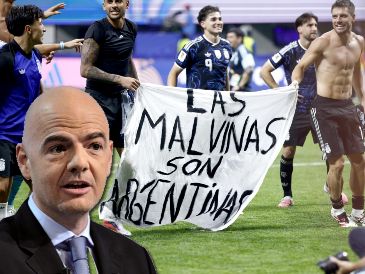 El momento que denuncia Reino Unido en el que jugadores argentinos toman una pancarta con el texto "Las Malvinas son Argentinas". EFE / EPA / WILL OLIVER