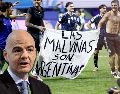 El momento que denuncia Reino Unido en el que jugadores argentinos toman una pancarta con el texto "Las Malvinas son Argentinas". EFE / EPA / WILL OLIVER