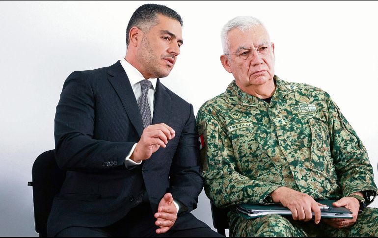 Los dos integrantes del gabinete se reunieron en Morelia. AFP