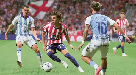 Los Colchoneros aseguraron los primeros tres puntos de la campaña con la victoria ante el Málaga. EFE