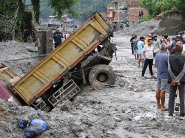 De las 546 personas que continúan sin localizar tras la riada, 261 son extranjeras y proceden de 23 países. EFE/YONHAP