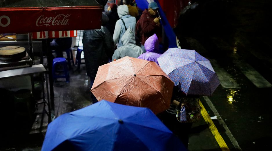 El SMN advierte sobre lluvias torrenciales, granizo y posibles inundaciones en varios estados de México por el monzón y la onda tropical 39. AFP/ARCHIVO