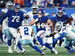La ofensiva neoyorquina dominó el tiempo de posesión y capitalizó los errores del rival para asegurar la victoria en este duelo divisional de la NFC Este. AFP.