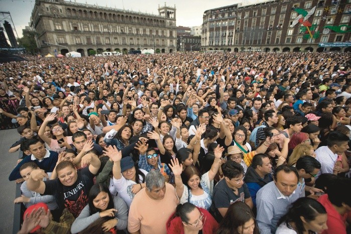 People enjoy during a concert in Mexico City's main square - People enjoy during a concert in Mexico City's main square, the Zocalo, Sunday, Oct. 8, 2017. The free concert, 