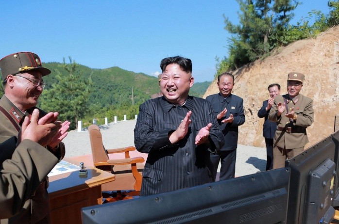 (FILES) This file photo released on July  5 - (FILES) This file photo released on July  5, 2017 by North Korea's official Korean Central News Agency (KCNA)  shows North Korean leader Kim Jong-Un (C) celebrating the successful test-fire of the intercontinental ballistic missile Hwasong-14 at an undisclosed location. A rocket launched by North Korea was an intercontinental ballistic missile (ICBM) that flew about 1,000 kilometers (620 miles) before splashing down in the Sea of Japan, the Pentagon said on November 28, 2017. According to an initial assessment, the missile was launched from Sain Ni in North Korea and flew within Japan's Economic Exclusion Zone (EEZ). - South Korea OUT / REPUBLIC OF KOREA OUT   ---EDITORS NOTE--- RESTRICTED TO EDITORIAL USE - MANDATORY CREDIT 