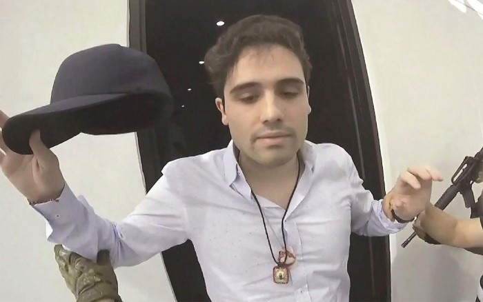 FILE - This Oct. 17, 2019 file frame grab from video provided by the Mexican government, shows Ovidio Guzman Lopez at the moment of his detention, in Culiacan, Mexico. Mexican security forces had Ovidio Guzman Lopez, a son of Joaquin 